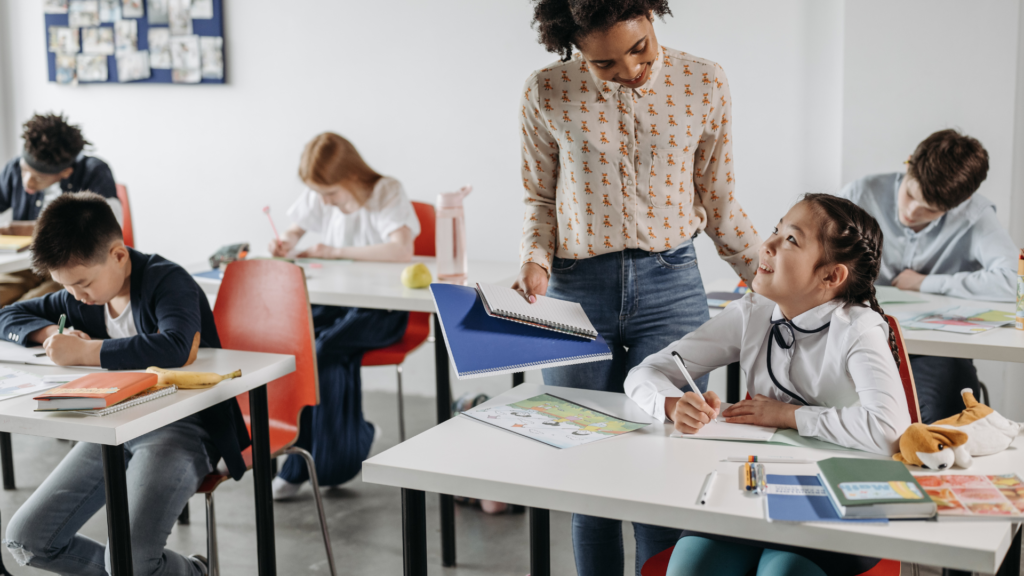 A teacher teaching students in a classroom.