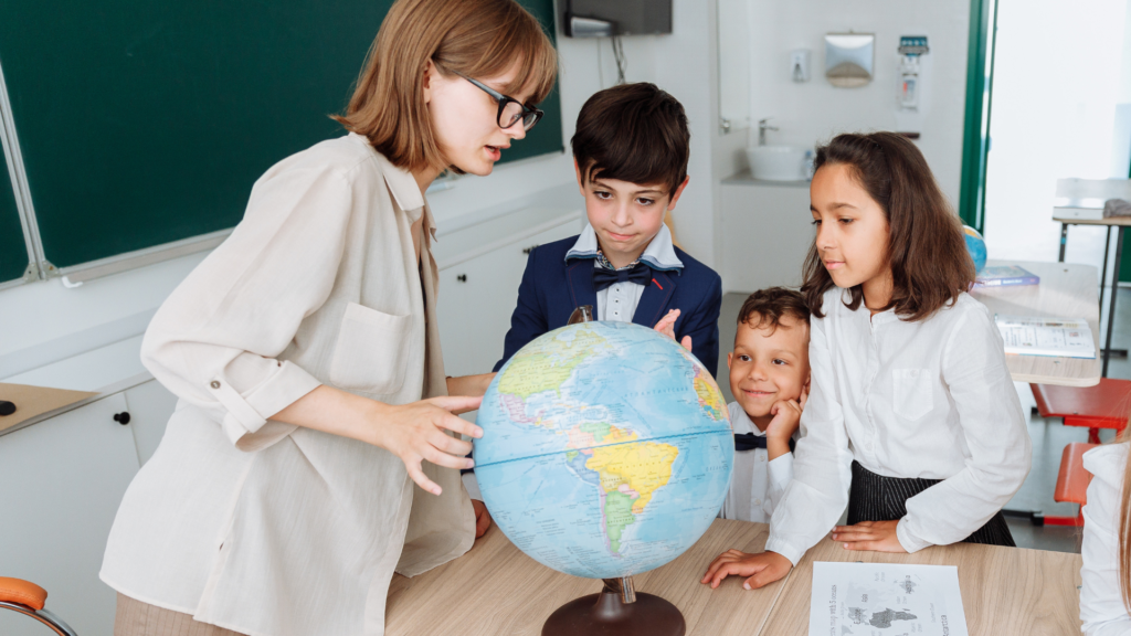A teacher in a classroom with students.